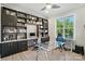 Brightly lit home office with a modern ceiling fan and lots of built-ins at 200 Squash Harvest Ct, Matthews, NC 28104