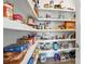 Walk-in pantry with wood shelving and ample storage space at 200 Squash Harvest Ct, Matthews, NC 28104