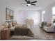 Bright bedroom with a ceiling fan, neutral walls, and modern decor at 2063 Sadler Woods Ln, Charlotte, NC 28214