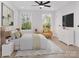 Bright bedroom with a ceiling fan, neutral walls, and modern decor at 2063 Sadler Woods Ln, Charlotte, NC 28214