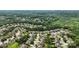 Aerial view of a scenic residential area surrounded by lush greenery and mature trees at 2377 Maple Grove Nw Ln, Concord, NC 28027
