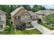 Aerial view of a beautiful two-story home, showcasing its lush landscaping and attached two-car garage at 2377 Maple Grove Nw Ln, Concord, NC 28027