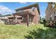 This backyard has a wooden pergola that offers shade, adjacent to a stone firepit at 2377 Maple Grove Nw Ln, Concord, NC 28027