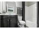 Bathroom featuring a sleek vanity, shower and tub combination with a window at 2377 Maple Grove Nw Ln, Concord, NC 28027