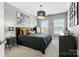 Bedroom features modern decor, a stylish chandelier and plenty of natural light at 2377 Maple Grove Nw Ln, Concord, NC 28027