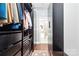 Walk-in closet with custom shelving and ample storage at 2377 Maple Grove Nw Ln, Concord, NC 28027