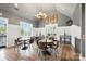 Bright dining area with wood floors, classic decor, and large windows providing abundant natural light at 2377 Maple Grove Nw Ln, Concord, NC 28027