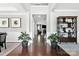 Inviting home foyer showcasing dark wood flooring, elegant decor, neutral walls, and a seamless transition into the living spaces at 2377 Maple Grove Nw Ln, Concord, NC 28027