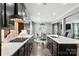 Open-concept kitchen with stainless steel appliances and a view of the breakfast area at 2377 Maple Grove Nw Ln, Concord, NC 28027