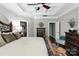 Spacious primary bedroom featuring a tray ceiling and a decorative bed frame at 2377 Maple Grove Nw Ln, Concord, NC 28027