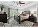 Elegant primary bedroom with coffered ceiling and dark wood trim at 2377 Maple Grove Nw Ln, Concord, NC 28027