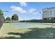 Well-maintained community tennis court near residential buildings at 2377 Maple Grove Nw Ln, Concord, NC 28027