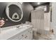 Bathroom features a white sink and white cabinets, and a tiled bathtub at 3003 Wedge Ct, Matthews, NC 28104