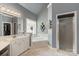 This primary bathroom features a soaking tub, shower, and vanity with ample counter space at 3003 Wedge Ct, Matthews, NC 28104