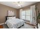 The bedroom features hardwood floors, a bed, and a large window for plenty of natural light at 3003 Wedge Ct, Matthews, NC 28104