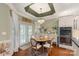 Charming breakfast nook features a round table, chandelier, and access to a patio with white french doors at 3003 Wedge Ct, Matthews, NC 28104