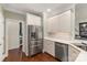 This kitchen area boasts stainless steel appliances, white cabinetry, and a tile backsplash at 3003 Wedge Ct, Matthews, NC 28104
