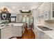 Open concept kitchen with white cabinets, stone countertops, and a view to the breakfast nook at 3003 Wedge Ct, Matthews, NC 28104