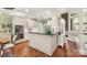 Bright kitchen features white cabinets, modern appliances, a peninsula, and an open view to the adjacent living room at 3003 Wedge Ct, Matthews, NC 28104
