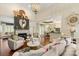 Inviting living room with fireplace, hardwood floors, high ceilings, and open layout to kitchen at 3003 Wedge Ct, Matthews, NC 28104
