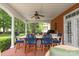 Covered patio with an outdoor dining area with seating for six, and a lush green backyard at 3003 Wedge Ct, Matthews, NC 28104