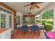 Covered patio with an outdoor dining area with seating for six, and a lush green backyard at 3003 Wedge Ct, Matthews, NC 28104