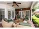 This outdoor seating area features comfortable wicker chairs and a view of the backyard at 3003 Wedge Ct, Matthews, NC 28104
