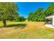 View of large, flat backyard surrounded by mature trees at 3248 Ferguson Long Rd, York, SC 29745