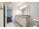Light filled bathroom with double vanity and marble flooring at 3248 Ferguson Long Rd, York, SC 29745