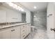 Bright bathroom featuring double vanity with granite countertops and glass enclosed shower with marble surround at 3248 Ferguson Long Rd, York, SC 29745