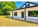 Inviting exterior with black door and trim, showcasing the home's entrance and covered porch at 3248 Ferguson Long Rd, York, SC 29745