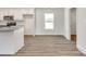 Bright kitchen and dining area with modern finishes and light wood-look flooring at 3248 Ferguson Long Rd, York, SC 29745
