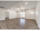 Bright, open-concept living area with neutral walls and modern laminate flooring, exuding a welcoming ambiance at 3248 Ferguson Long Rd, York, SC 29745
