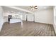 Open-concept space with modern flooring, seamlessly connecting the living area to the kitchen at 3248 Ferguson Long Rd, York, SC 29745