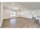 Spacious living room features light walls and flooring with recessed lights and a ceiling fan at 3248 Ferguson Long Rd, York, SC 29745