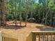 Spacious backyard featuring a wooden fence, a tree-filled perimeter, and a grass lawn at 372 Lippard Farm Rd, Statesville, NC 28625