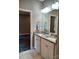 Double vanity with granite countertops and framed mirror in a renovated bathroom at 372 Lippard Farm Rd, Statesville, NC 28625
