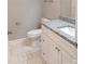 Renovated bathroom featuring granite countertops, modern fixtures, and tile flooring at 372 Lippard Farm Rd, Statesville, NC 28625