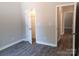 This bedroom features gray walls and wood-look flooring, and a closet for storage at 372 Lippard Farm Rd, Statesville, NC 28625