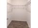 Walk-in closet featuring vinyl flooring and wire shelving for easy storage at 372 Lippard Farm Rd, Statesville, NC 28625