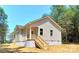 Charming single-story home with neutral siding, a welcoming porch, and a well-maintained yard at 372 Lippard Farm Rd, Statesville, NC 28625