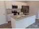 Beautiful kitchen island with granite countertops and stainless steel appliances at 372 Lippard Farm Rd, Statesville, NC 28625