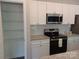Well-lit kitchen featuring granite countertops and stainless steel appliances at 372 Lippard Farm Rd, Statesville, NC 28625