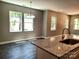 Open-concept kitchen features granite countertops and views to the outdoors at 372 Lippard Farm Rd, Statesville, NC 28625