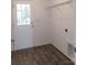 Convenient laundry room with modern gray flooring and ample space at 372 Lippard Farm Rd, Statesville, NC 28625