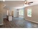 Bright, open-concept living space with an island bar and modern light fixtures at 372 Lippard Farm Rd, Statesville, NC 28625