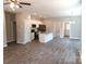 Inviting open-concept living and kitchen area with stainless steel appliances at 372 Lippard Farm Rd, Statesville, NC 28625