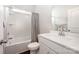 Bright bathroom featuring a tub with shower, single sink vanity and neutral gray shower curtain at 3816 Ernie Dr, Charlotte, NC 28269