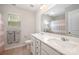 Bright bathroom featuring a double vanity, large mirror, and neutral color scheme, perfect for a modern home at 3816 Ernie Dr, Charlotte, NC 28269