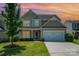 Charming two-story home with a well-manicured lawn, attached garage, and inviting curb appeal at 3816 Ernie Dr, Charlotte, NC 28269